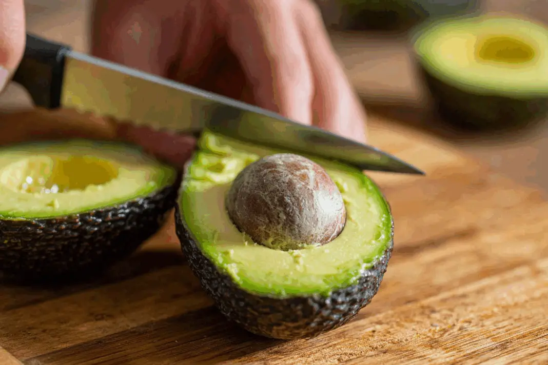 thingsyoudidntknow_cutting_an_avocado_with_knife_in_hand_--ar_21ce84d6-2ff9-4968-a294-3260e0204b94_0