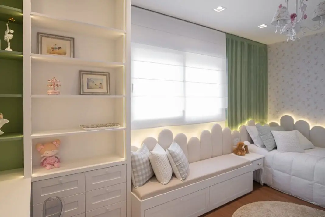 A cozy bedroom with a window seat and shelves. | Photo by Caroline Badran on Unsplash