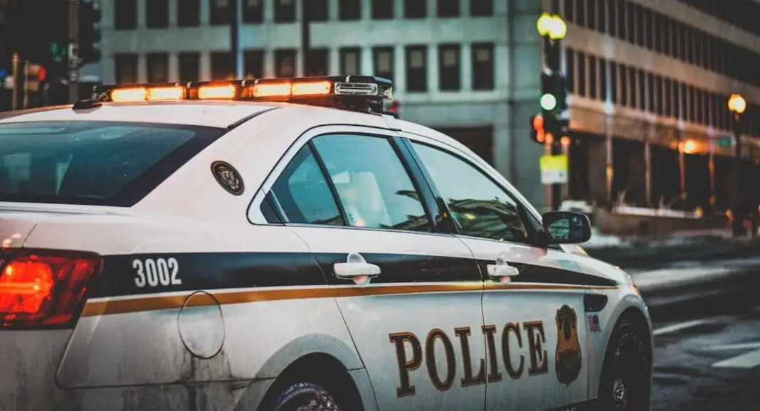 A police car belonging to the United States Secret Service Uniformed Division patrols a street adjacent to the White House in Washington, DC.