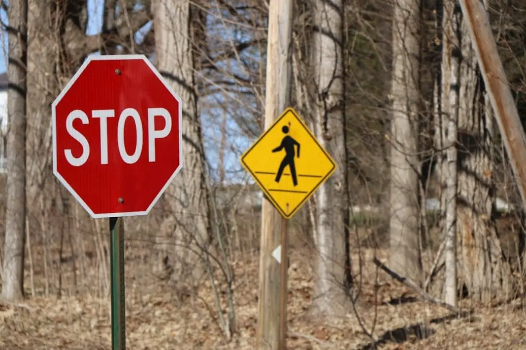 ambiguity of signage; stop pedestrian crossing