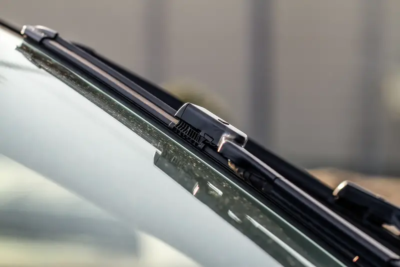 Car windwhield wiper close up.