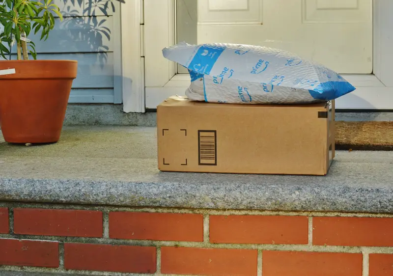 Package Delivery Residential House Amazon Order on Front Doorstep Homer
