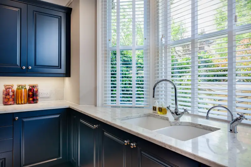 Blue kitchen cabinet and counter detail