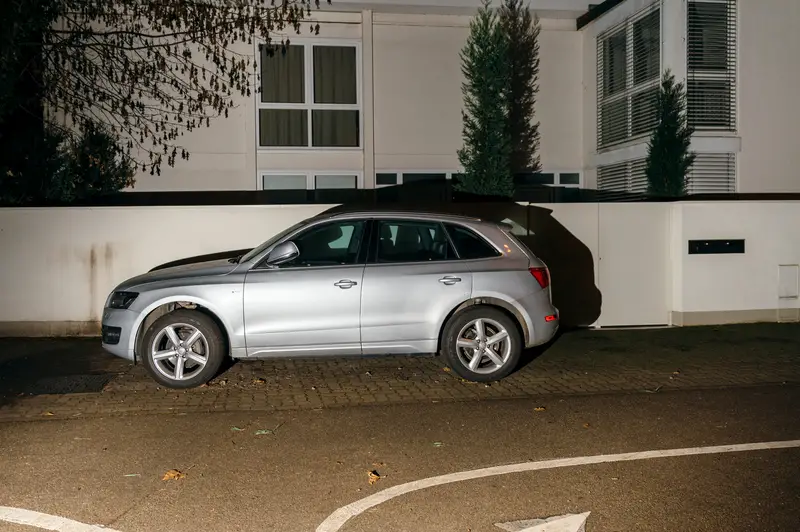 Beautiful AUDI SUV car parked in night city