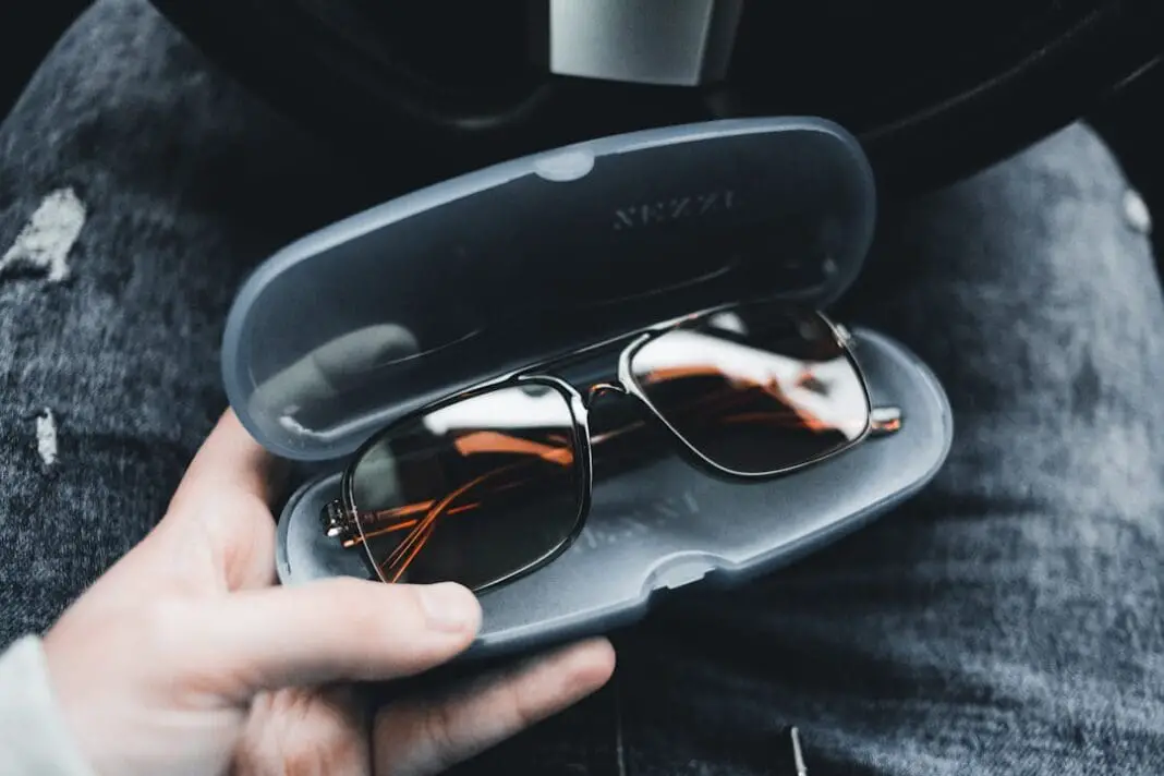 black framed eyeglasses on black case