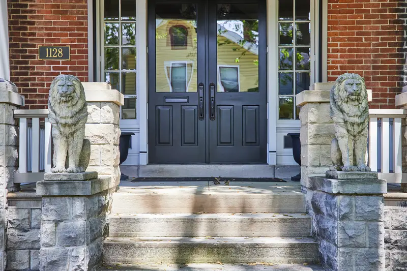 Elegant Suburban Home Entrance with Lion Statues, Fort Wayne