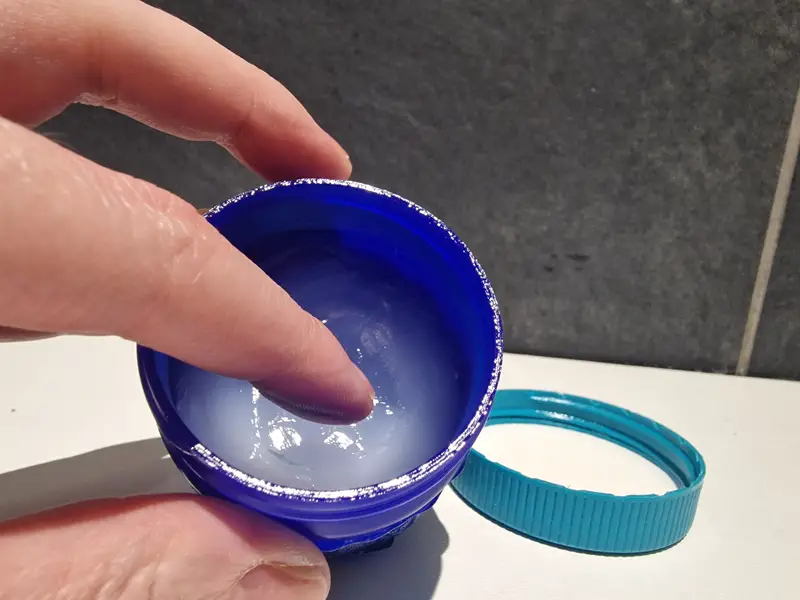 Women holding menthol vapor rub product, to relive chesty coughs and sinus infections. Topical treatment for colds and flu